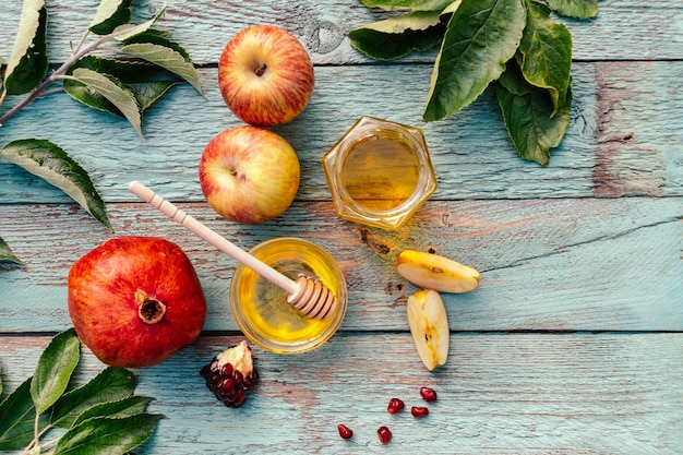 Apple and honey and pomegranate, traditional food of jewish New Year - Rosh Hashana.