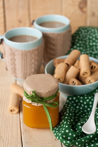 Apple jam, biscuits and coffee with milk for breakfast