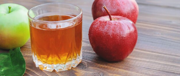 Apple juice in a glass. Selective focus.