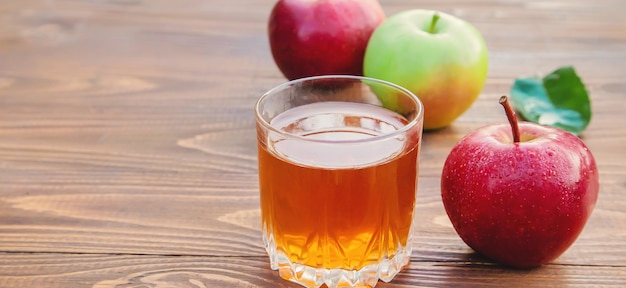 Apple juice in a glass. Selective focus.