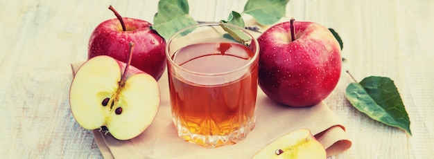 Photo apple juice in a glass. selective focus.