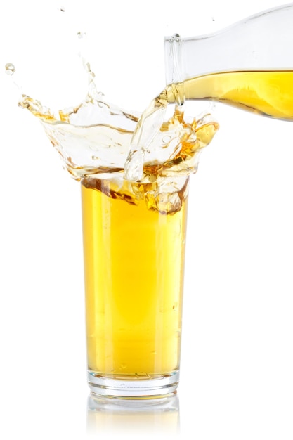 Apple juice pouring pour splash splashing glass bottle isolated on white