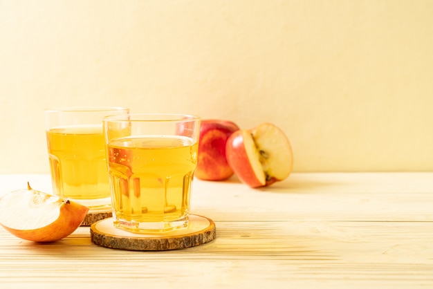 Apple juice with red apples fruits