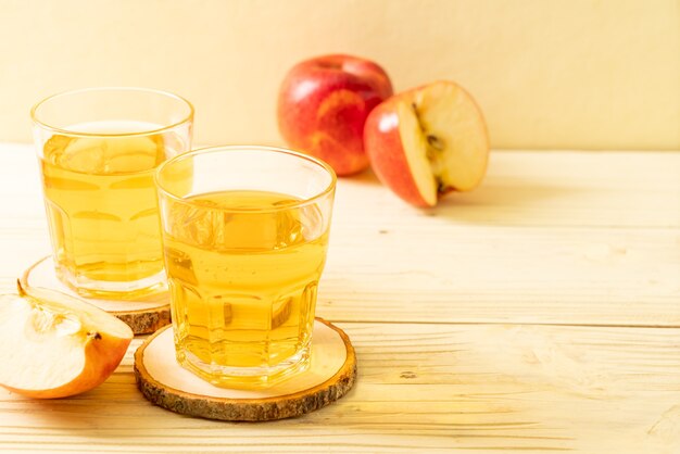 Apple juice with red apples fruits