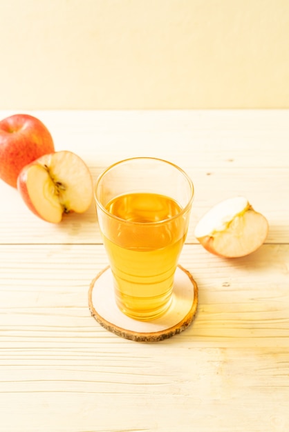 Apple juice with red apples fruits