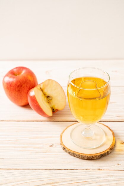 Apple juice with red apples fruits