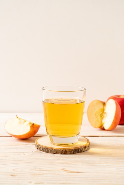 Apple juice with red apples fruits