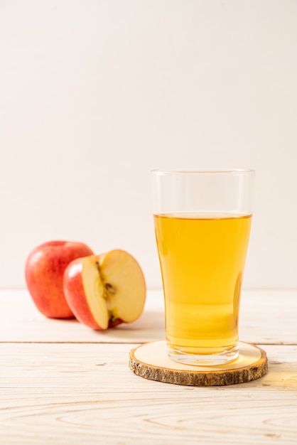 Apple juice with red apples fruits