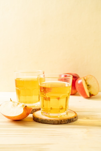 Apple juice with red apples fruits