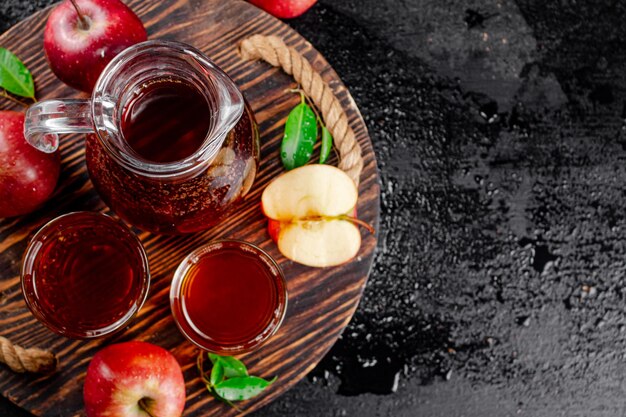 Apple juice on a wooden tray