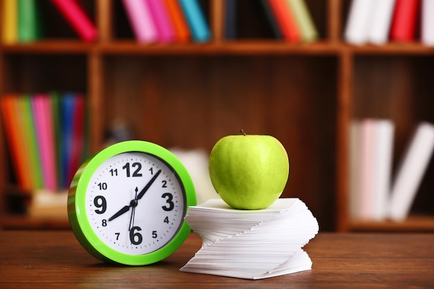 Photo apple and paper on table in the room