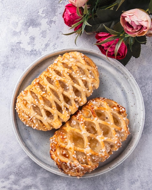 Apple pastries on a plate Top view