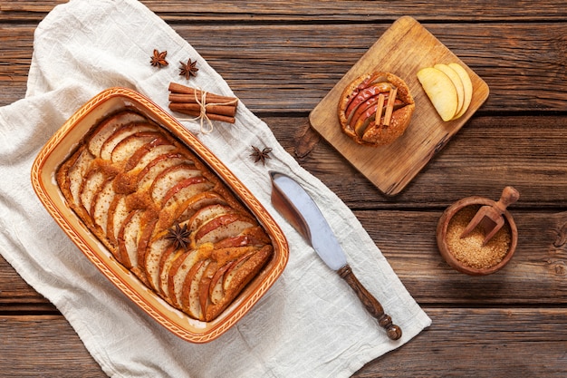 Apple pie, apple slices, cinnamon sticks and anise