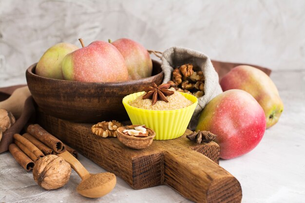 Apple pie ingredients over stone table