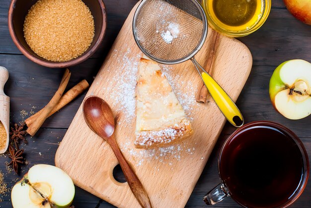 Apple pie and tea on a wooden table