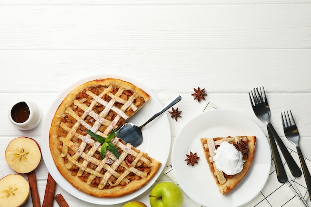 apple pie on white wooden background