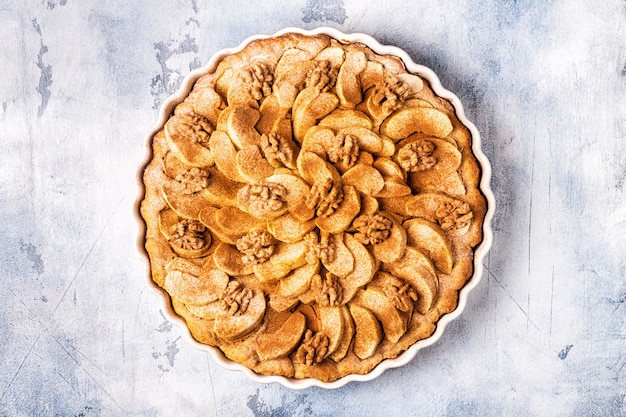 Apple pie with walnuts and cinnamon