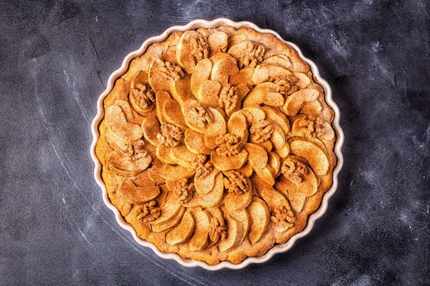 Apple pie with walnuts and cinnamon