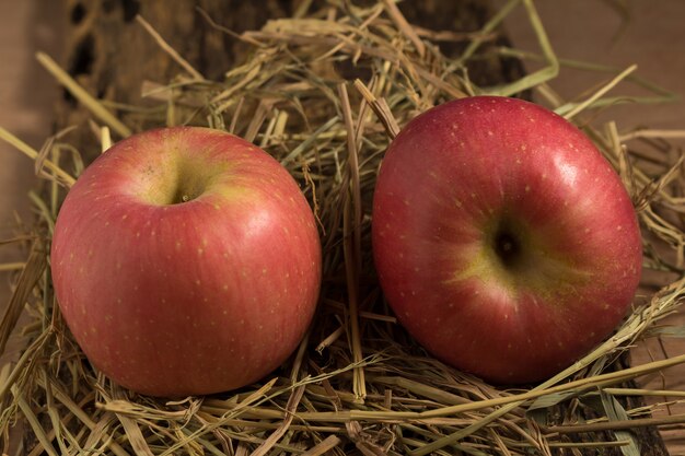 Apple. straw. on wood