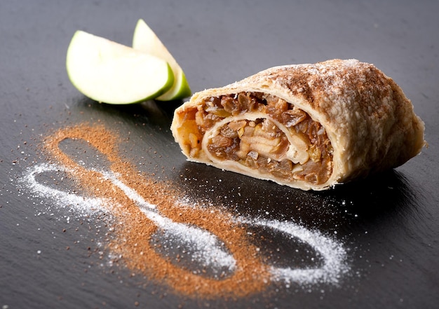 Apple strudel on a stone blackboard