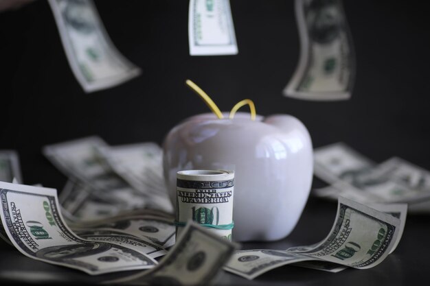 Apple on table with money dollars banknotes Us business concept New york big apple