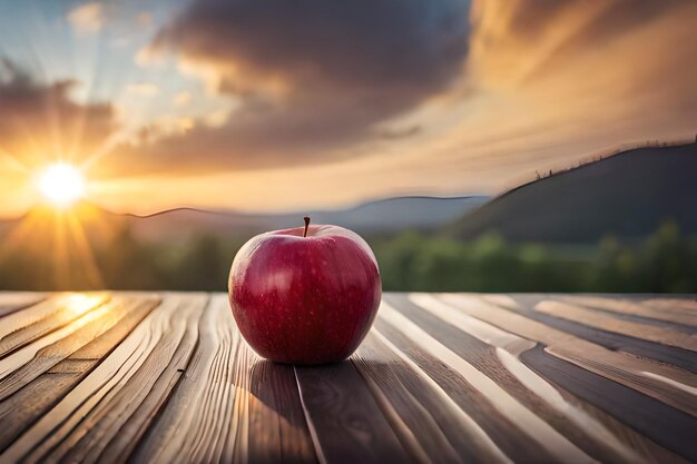 An apple on a table with a sunset in the background