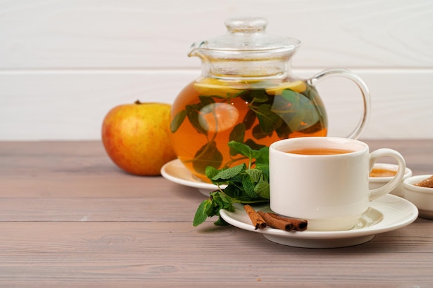 Apple tea drink served on wooden table