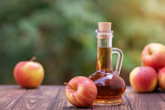 Photo apple vinegar in glass pitcher