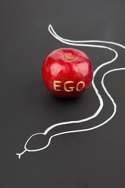 Photo apple with ego letters and snake