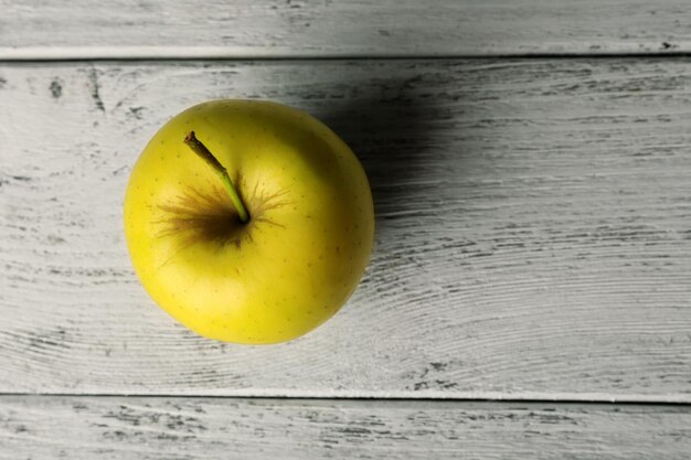 Apple on wooden background