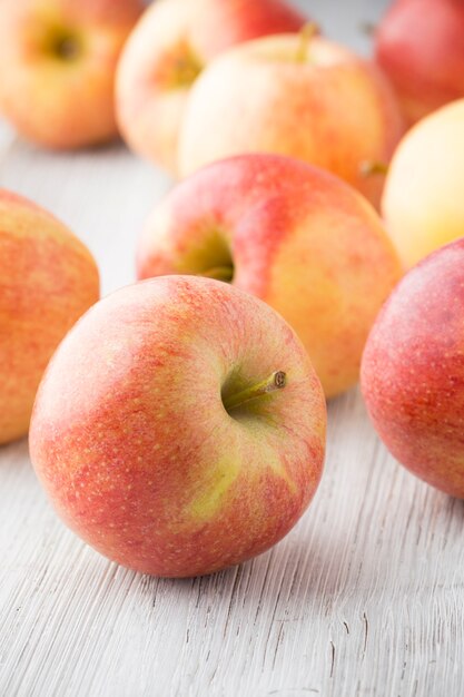 Apple on the wooden surface.