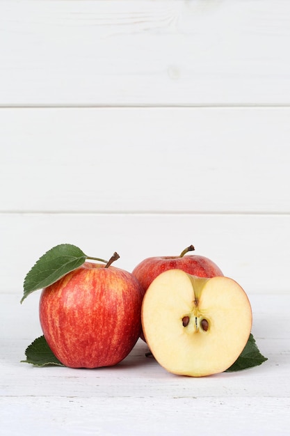 Apples apple slice fruit fruits red portrait format copyspace on wooden board