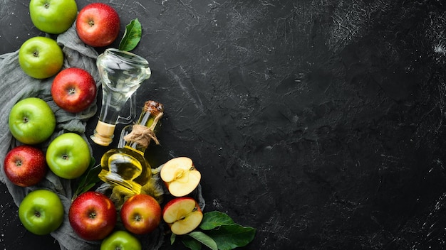 Apples and apple vinegar on the old background Fruits Top view Free space for text