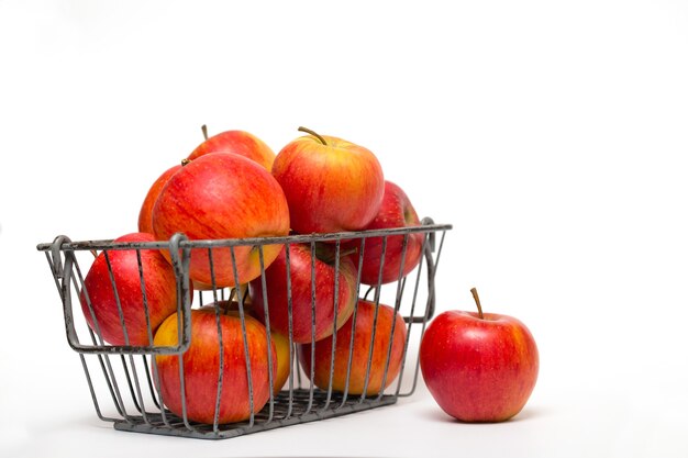 Apples in a basket on a white background