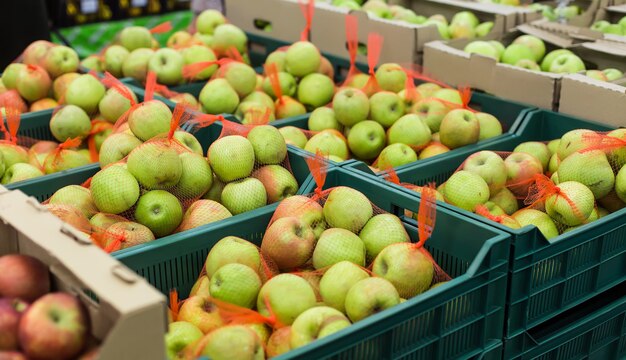 Apples in the boxes at the supermarket