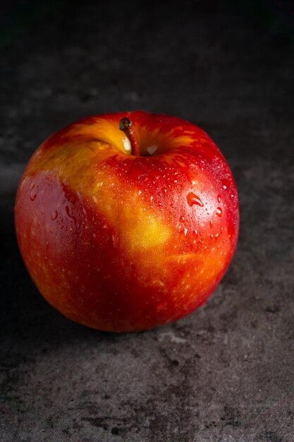 Apples in a dramatic low key concept with a dark background in variety angles