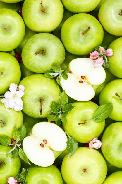 Apples fruits green apple fruit background with leaves and blossoms portrait format