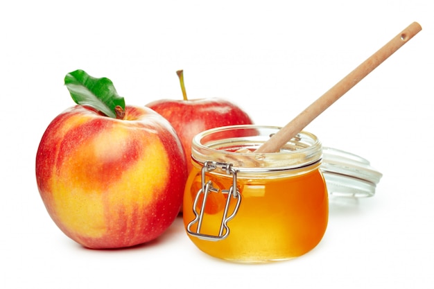 Apples and honey jar for jewish new year holiday isolated