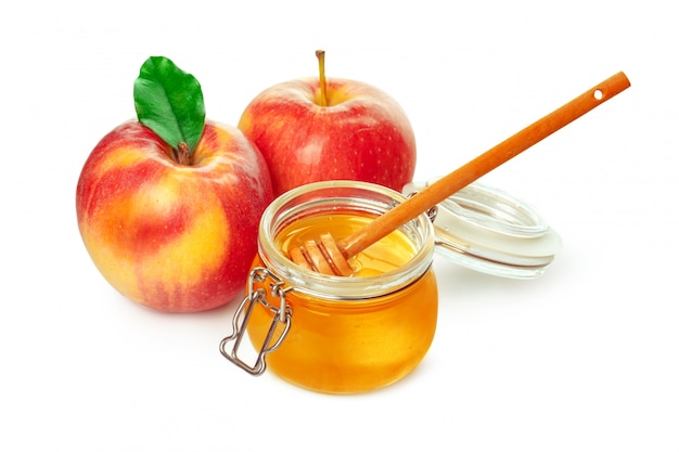 Apples and honey jar for jewish new year holiday isolated