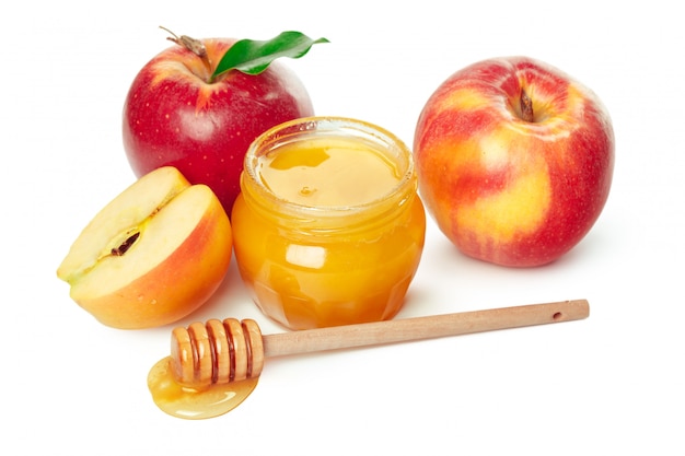 Apples and honey jar for jewish new year holiday isolated