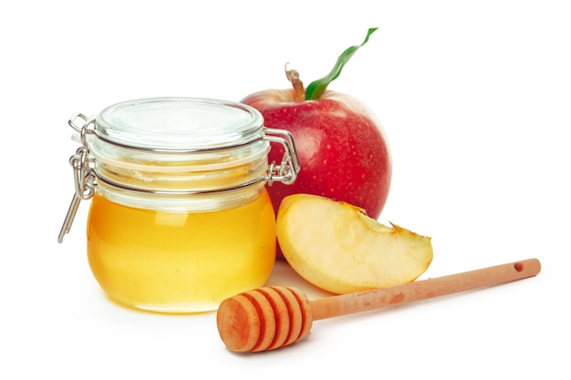 Apples and honey jar for jewish new year holiday isolated