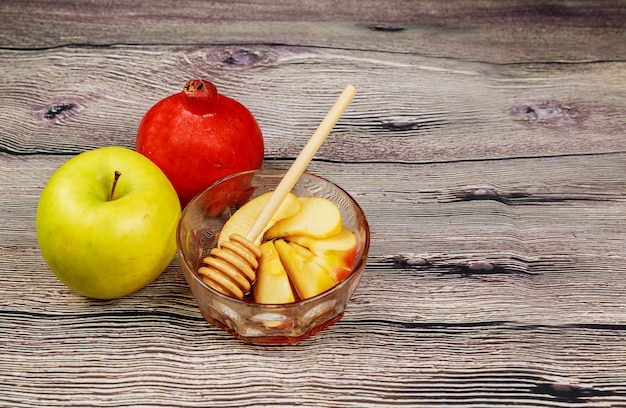 Photo apples, pomegranate and honey for rosh hashanah