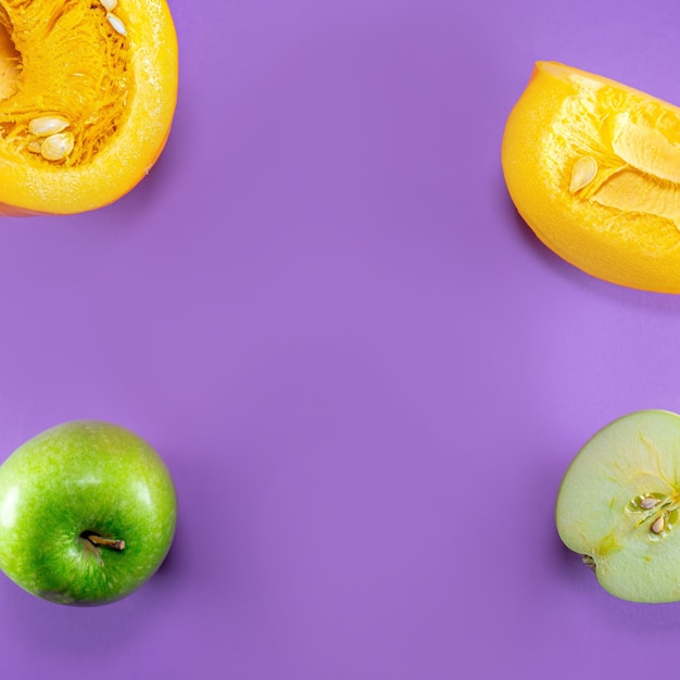 apples and pumpkins on purple