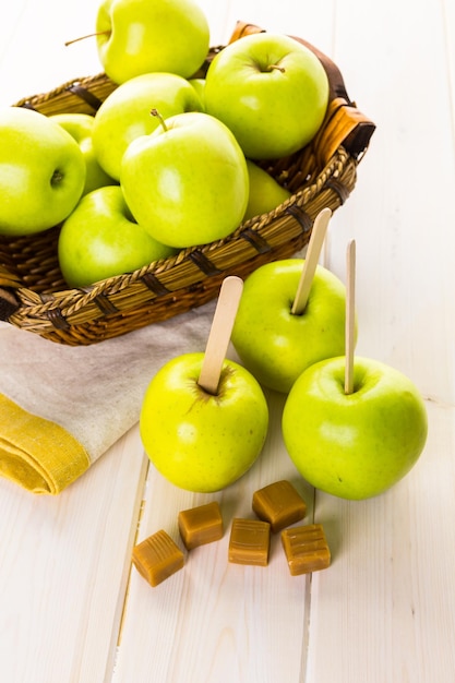 Apples ready to deeped in fresh caramel.