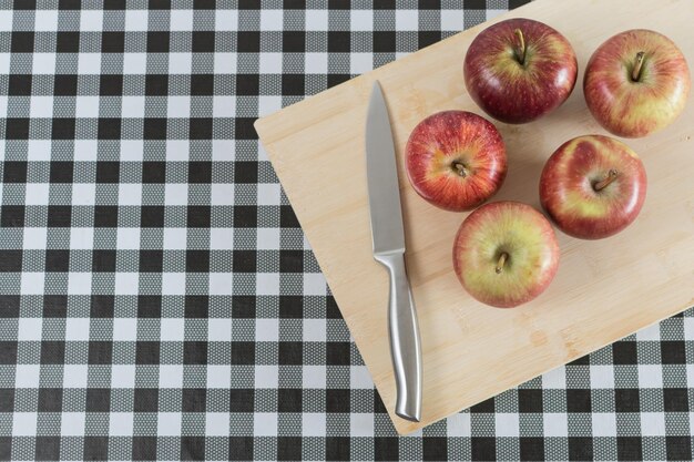 Apples on wooden board