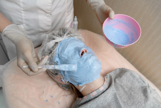 Application of a cosmetology mask on the face.