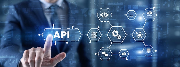 Foto application programming interface api strumento di sviluppo software concetto di tecnologia dell'informazione imprenditore preme l'icona di testo api su un'interfaccia virtuale