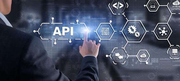 application programming interface api software development tool information technology concept businessman presses api text icon on a virtual interface