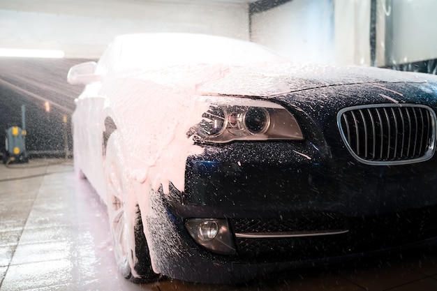 Photo applying foam to the car.