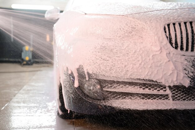 Applying foam to the car.